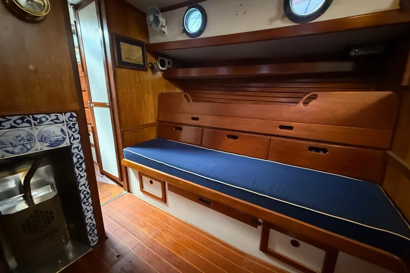 Slide: The Image of Interior of 1981 Kaiser 34' Gale Force cutter with wood paneling and decorative tiles. - 10