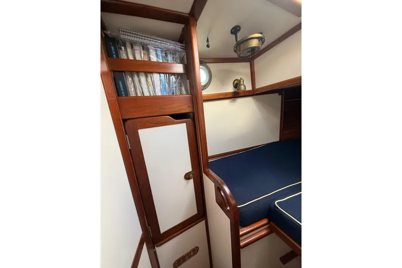 Slide: The Image of Interior of 1981 Kaiser 34' Gale Force offshore cutter with cozy cabin and wooden accents. - 14