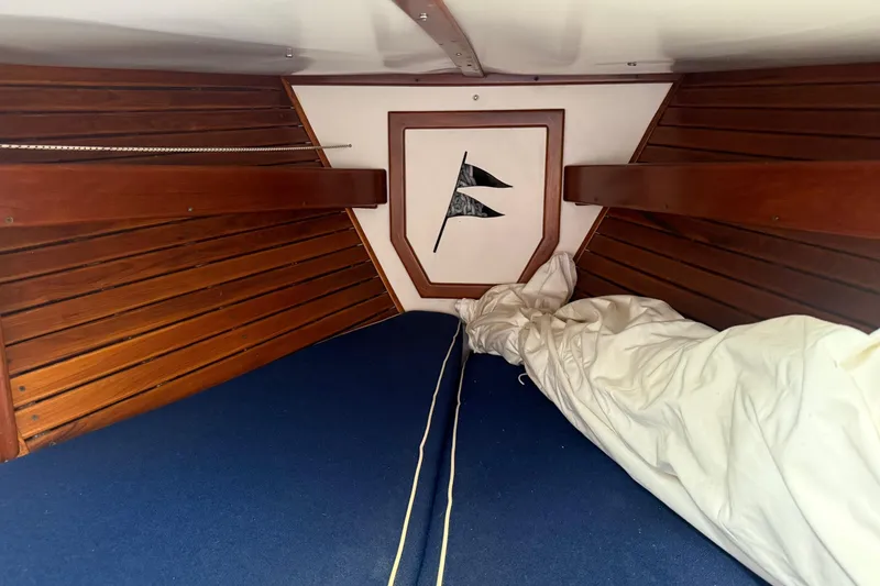 Slide: The Image of Interior cabin of 1981 Kaiser 34' Gale Force offshore cutter with blue bedding. - 16