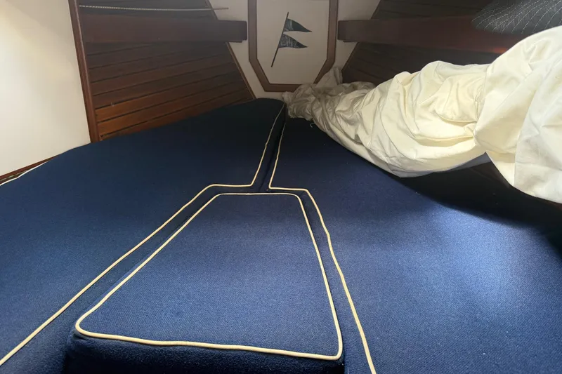 Slide: The Image of Interior of 1981 Kaiser 34' Gale Force cutter, featuring a compact bathroom with wooden accents. - 17
