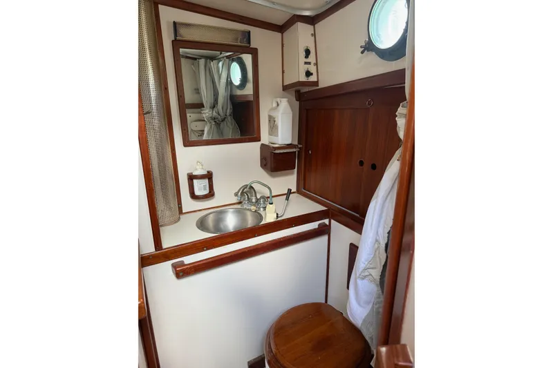 Slide: The Image of Interior of 1981 Kaiser 34' Gale Force offshore cutter with cozy cabin and wooden accents. - 18