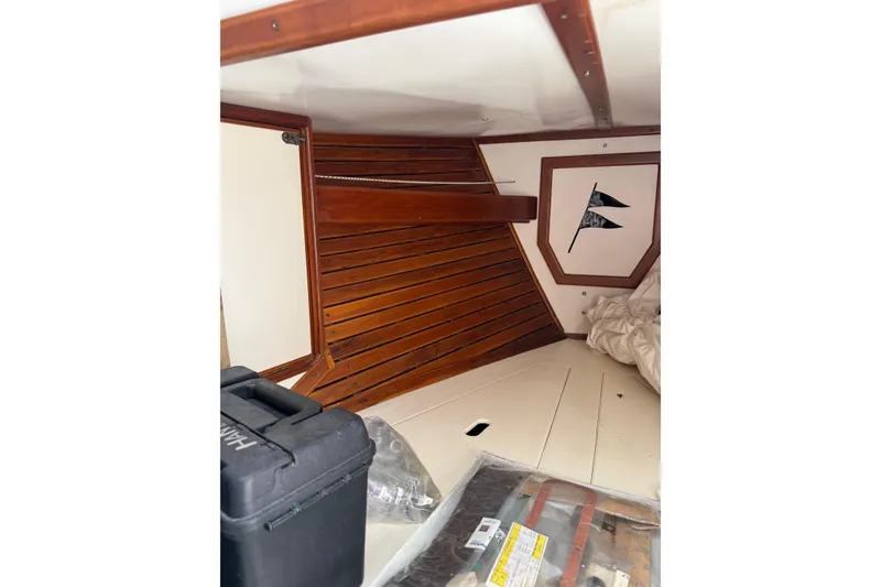 Slide: The Image of Interior of 1981 Kaiser 34' Gale Force cutter with wooden cabinetry and sink. - 24