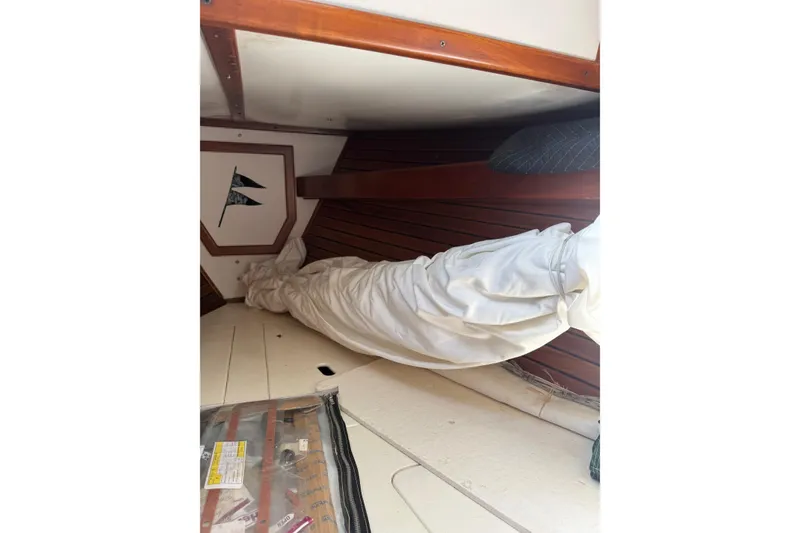 Slide: The Image of Interior of 1981 Kaiser 34' Gale Force offshore cutter, featuring wood paneling and blue seating. - 25