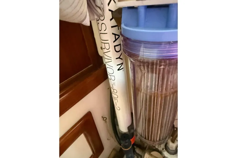 Slide: The Image of 1981 Kaiser 34' Gale Force offshore cutter on land, surrounded by other boats. - 29