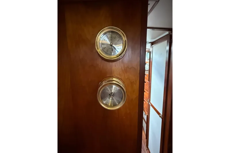 Slide: The Image of 1981 Kaiser 34' Gale Force offshore cutter in boatyard, wooden deck, green covers. - 3