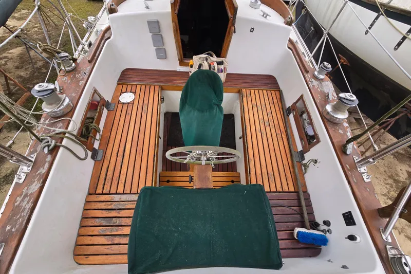 Slide: The Image of 1981 Kaiser 34' Gale Force offshore cutter cockpit with wheel and compass. - 35