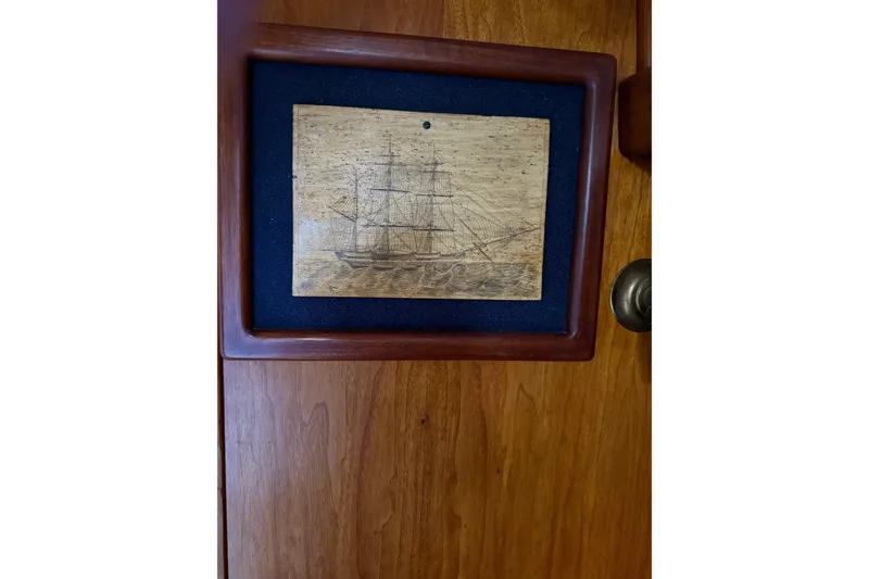 Slide: The Image of Interior of 1981 Kaiser 34' Gale Force offshore cutter with wooden finish and blue cushions. - 4