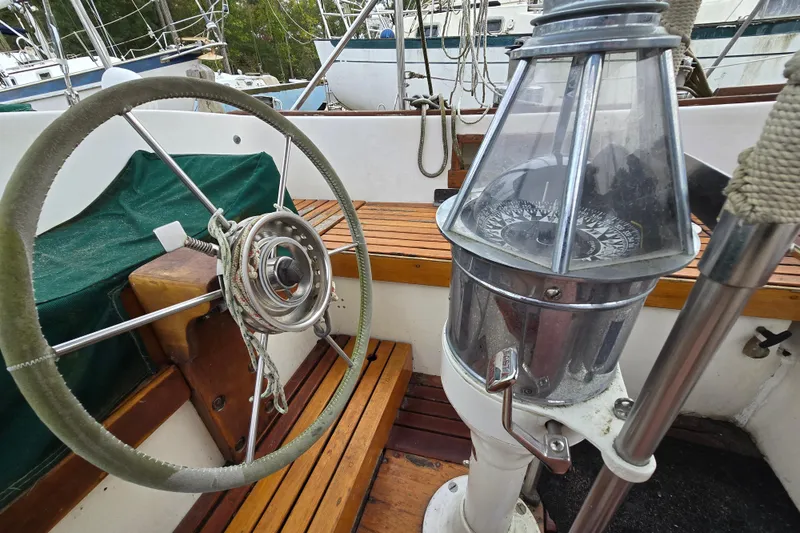 Slide: The Image of Engine compartment of 1981 Kaiser 34' Gale Force offshore cutter, featuring red mechanical components. - 42