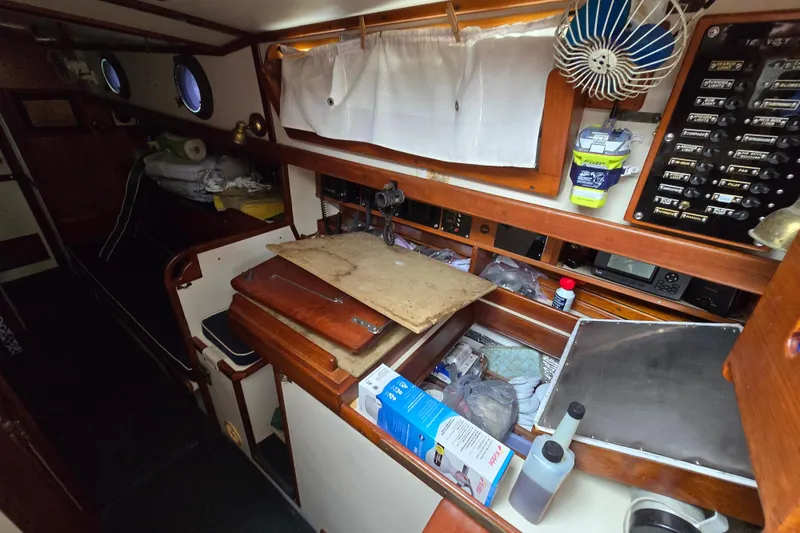 Slide: The Image of Interior of 1981 Kaiser 34' Gale Force offshore cutter with wood paneling and nautical decor. - 44
