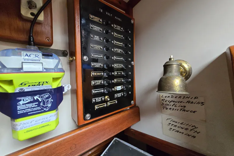 Slide: The Image of Interior of 1981 Kaiser 34' Gale Force offshore cutter, featuring wooden paneling and nautical decor. - 46