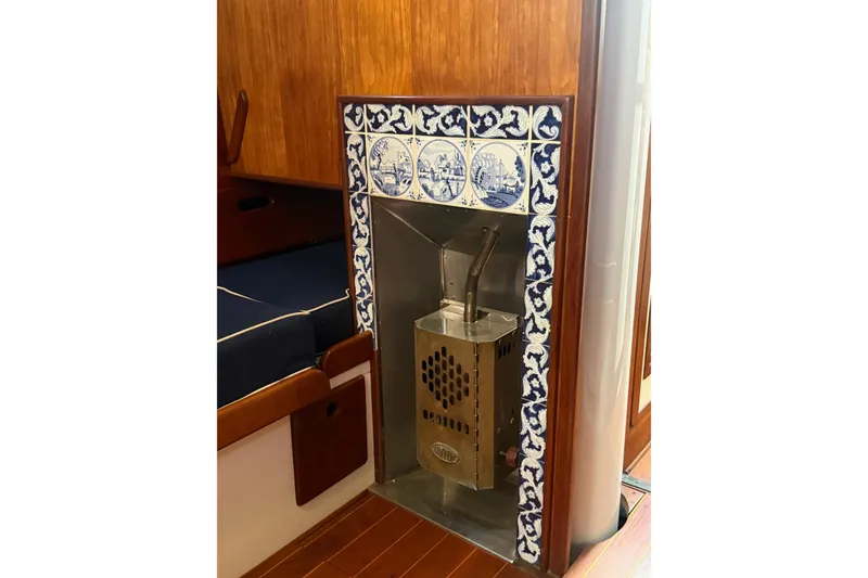 Slide: The Image of Interior of 1981 Kaiser 34' Gale Force cutter with wooden finish and nautical decor. - 5