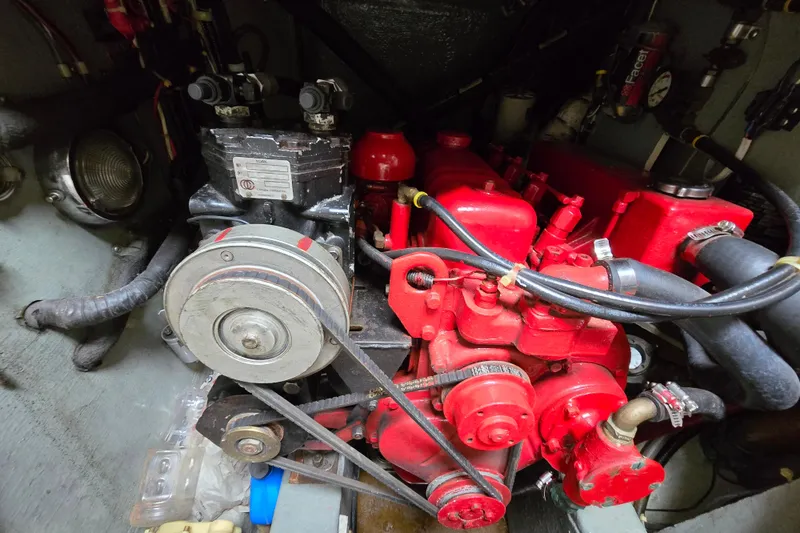 Slide: The Image of Interior view of 1981 Kaiser 34' Gale Force offshore cutter, showcasing wooden cabinetry and cockpit access. - 50
