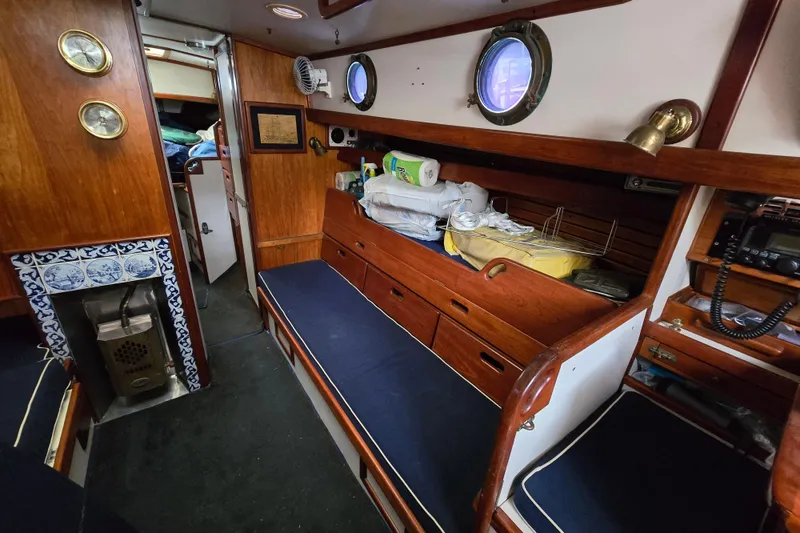 Slide: The Image of Engine compartment of 1981 Kaiser 34' Gale Force offshore cutter, showing hoses and wiring. - 51