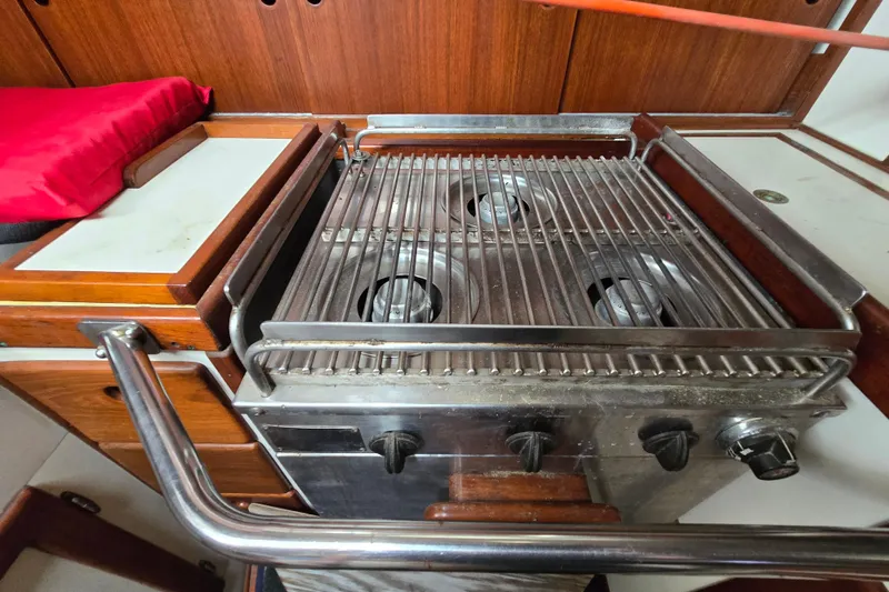 Slide: The Image of 1981 Kaiser 34' Gale Force offshore cutter deck with wooden details and winches. - 53