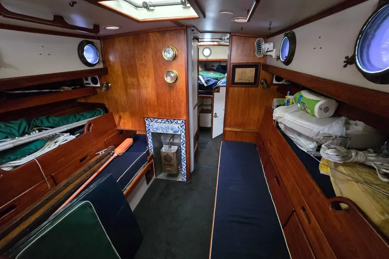 Slide: The Image of Storage area on a 1981 Kaiser 34' Gale Force offshore cutter with cables and equipment. - 54