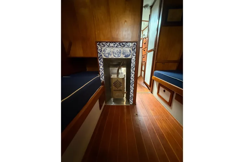 Slide: The Image of Wood-paneled interior of 1981 Kaiser 34' Gale Force cutter with decorative tiles and heater. - 8