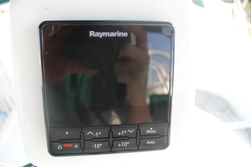 Slide: The Image of Raymarine control panel on a 2001 Beneteau 411 sailboat. - 16