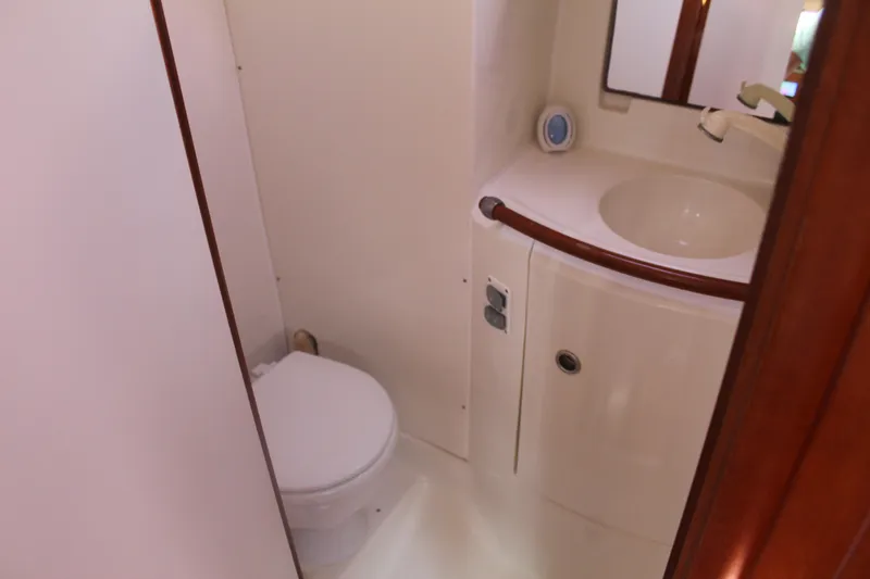 Slide: The Image of Bathroom interior of 2001 Beneteau 411 yacht with sink and toilet. - 26