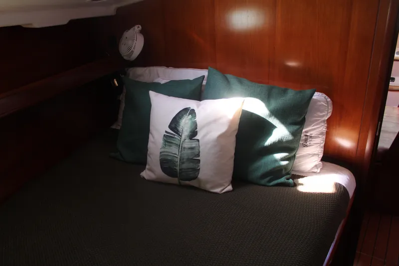 Slide: The Image of Cozy cabin interior of 2001 Beneteau 411 yacht with decorative pillows. - 33