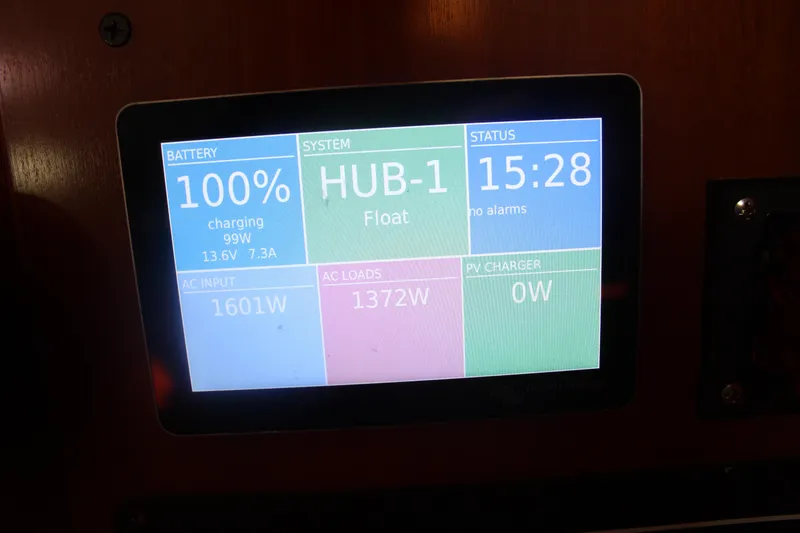 Slide: The Image of Display screen on 2001 Beneteau 411 showing battery status and system information. - 37