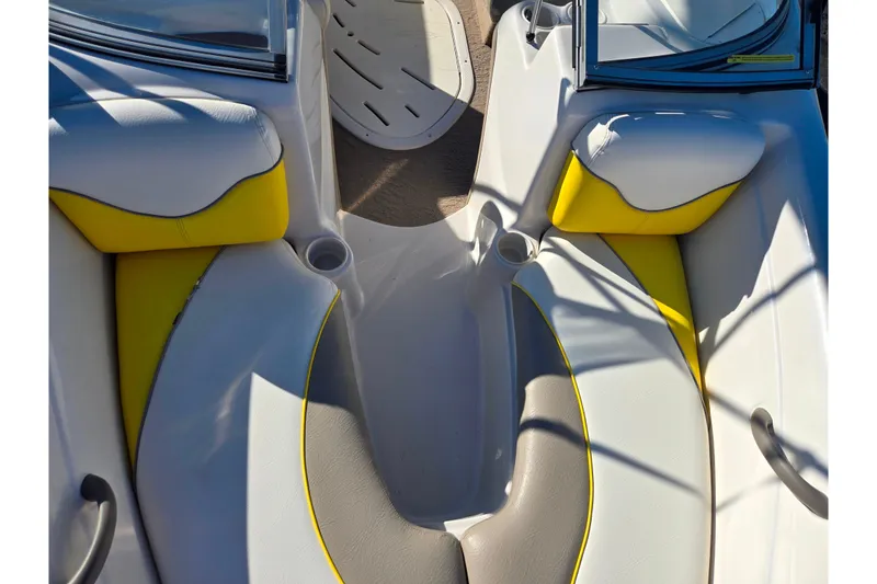 Slide: The Image of 2006 Tahoe Q4 Sport boat interior with yellow and white seating. - 17