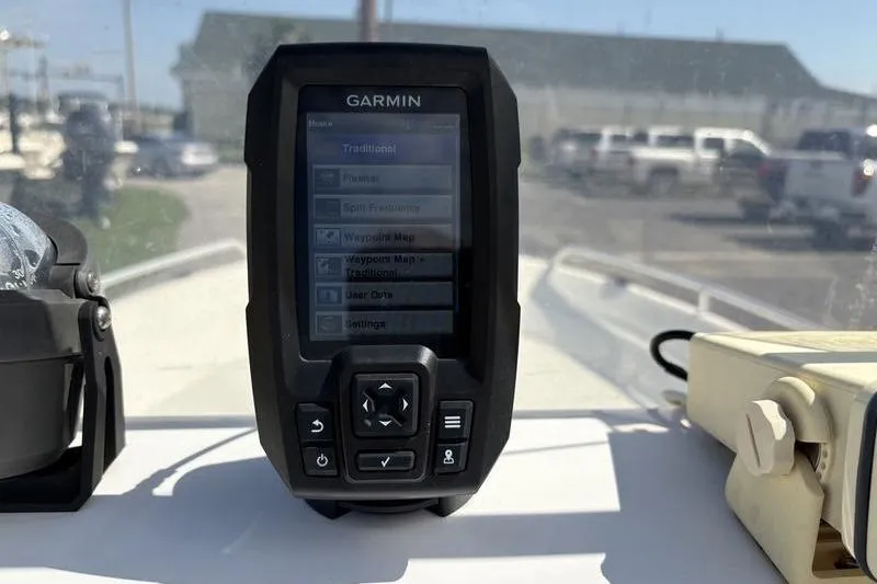 Slide: The Image of Garmin GPS device on 2004 Carolina Skiff 175 boat dashboard, outdoor setting. - 12