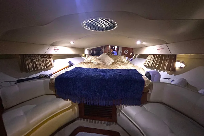 Slide: The Image of Luxurious cabin interior of 2005 Fountain 48 Express Cruiser with cozy bedding. - 11