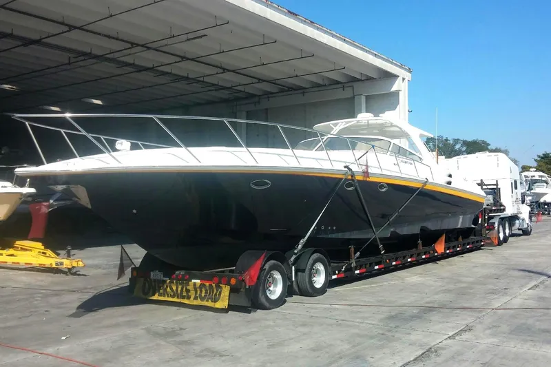 Slide: The Image of 2005 Fountain 48 Express Cruiser on trailer, parked in a boatyard. - 2