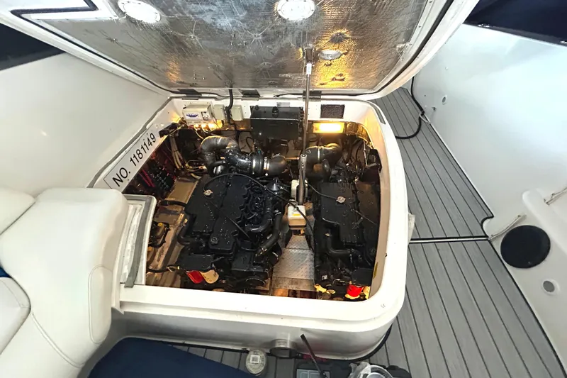 Slide: The Image of Engine compartment of a 2005 Fountain 48 Express Cruiser, showcasing dual engines and mechanical components. - 25