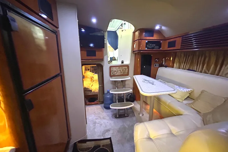 Slide: The Image of Luxurious interior of a 2005 Fountain 48 Express Cruiser with seating and dining area. - 5