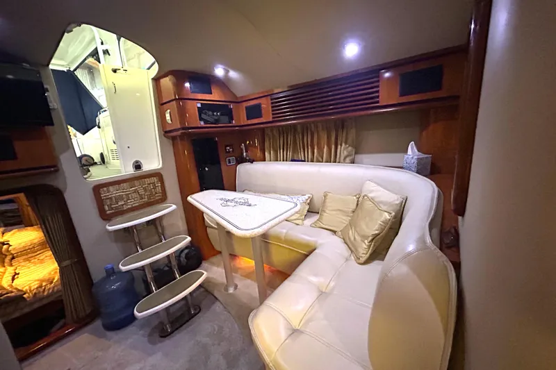 Slide: The Image of Luxurious interior of 2005 Fountain 48 Express Cruiser with plush seating and elegant decor. - 6