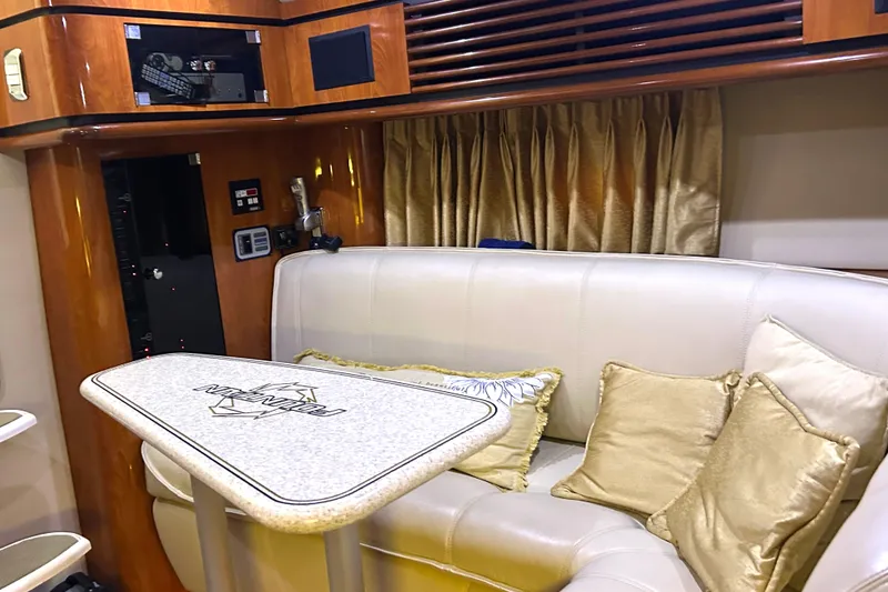 Slide: The Image of Luxurious interior of 2005 Fountain 48 Express Cruiser with plush seating and elegant decor. - 7