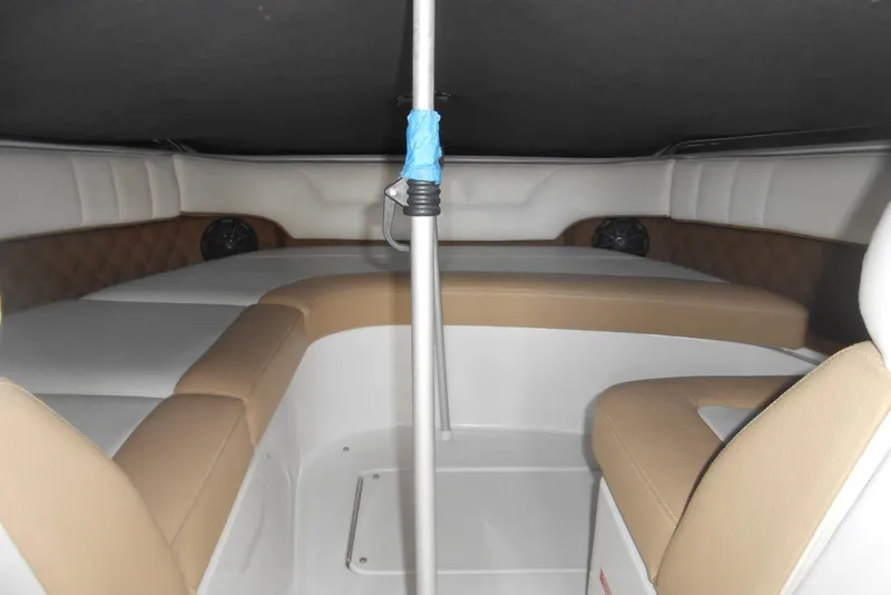 Slide: The Image of Interior of 2015 Cobalt 296 boat with beige and white seating. - 13