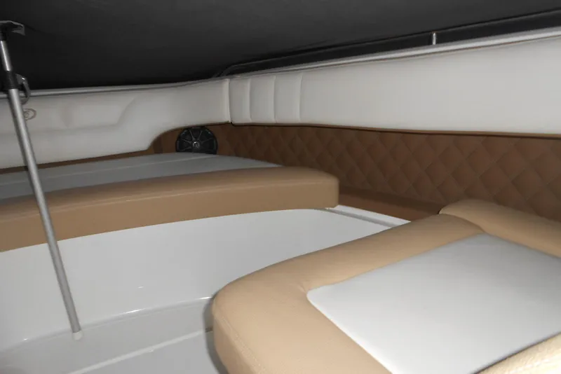 Slide: The Image of Interior of 2015 Cobalt 296 boat with tan and white seating. - 14
