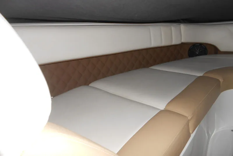 Slide: The Image of 2015 Cobalt 296 interior cabin with beige and white cushioned seating. - 15