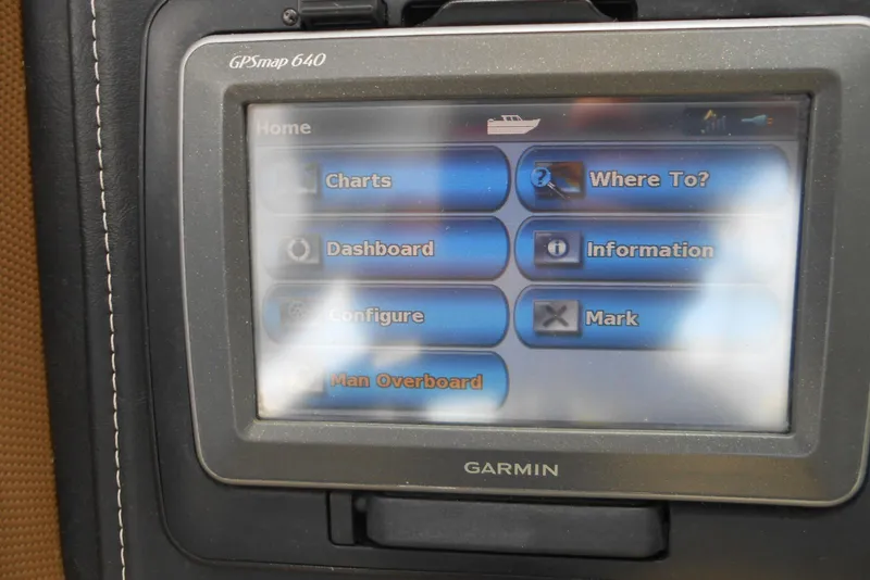 Slide: The Image of Garmin GPSmap 640 display in a 2015 Cobalt 296 boat, showing navigation options. - 19