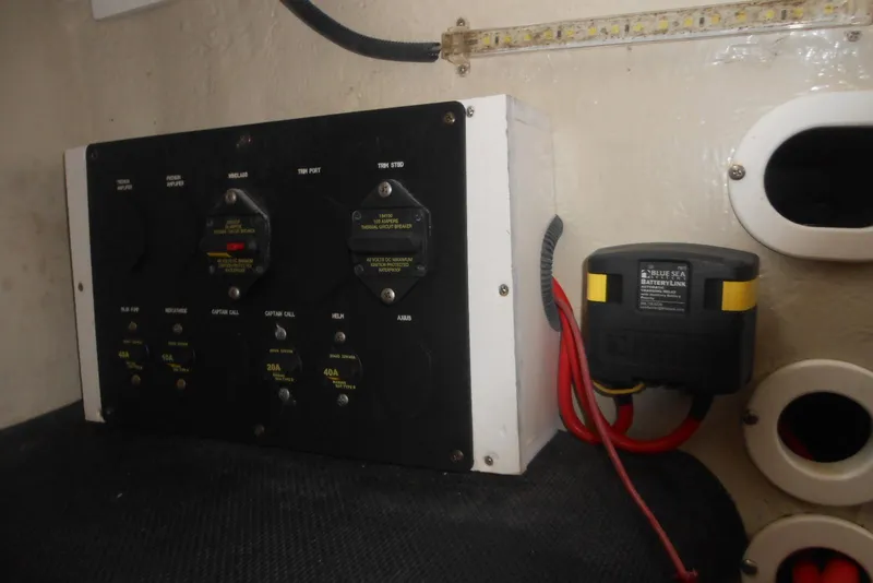 Slide: The Image of Electrical panel and battery link in 2015 Cobalt 296 boat interior. - 22