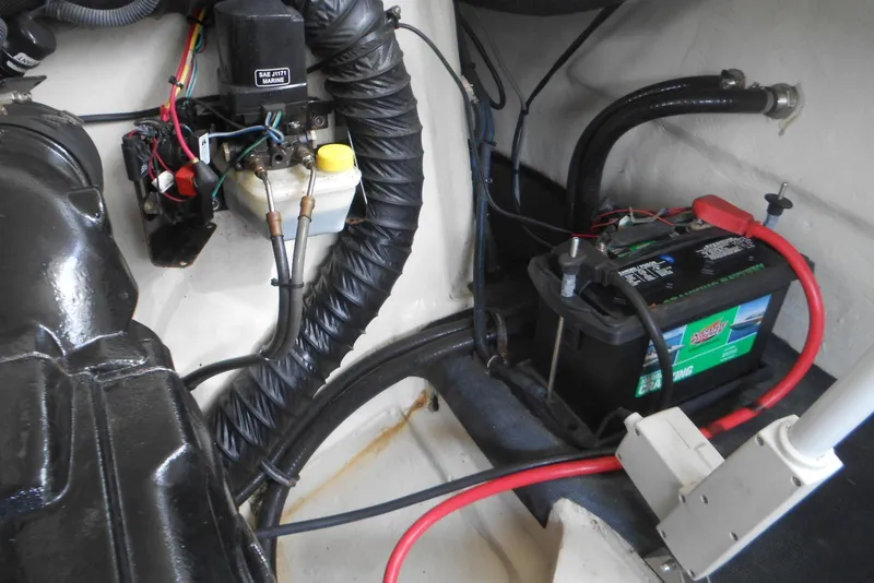 Slide: The Image of 2015 Cobalt 296 engine compartment with battery and wiring components. - 23