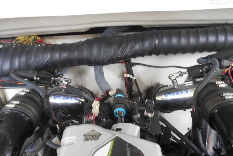 Slide: The Image of Engine compartment of a 2015 Cobalt 296 boat, featuring detailed components and wiring. - 24