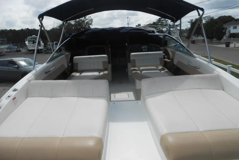Slide: The Image of 2015 Cobalt 296 boat interior with spacious seating and canopy. - 8