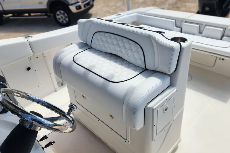 Slide: The Image of Luxurious seating on 2007 Triton 2895 CC boat with diamond-stitched upholstery. - 12