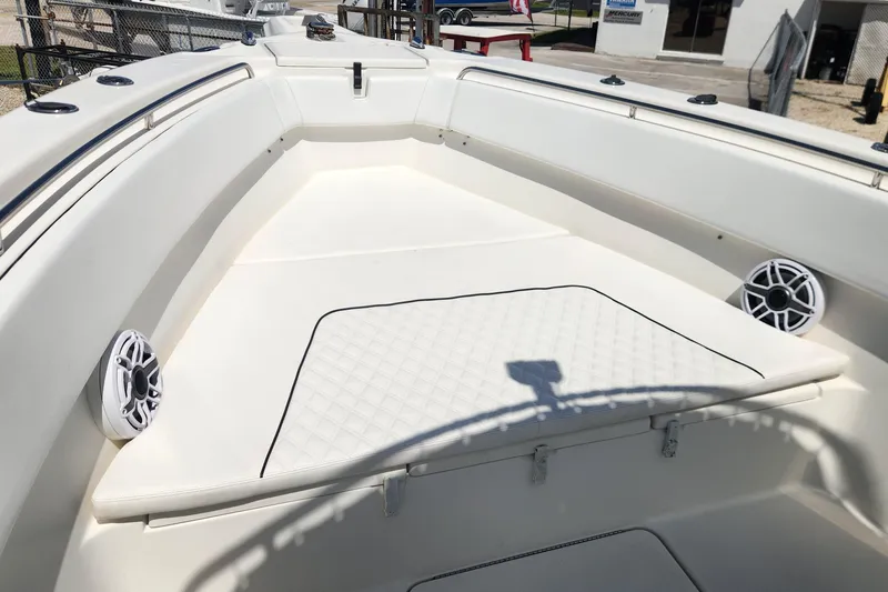 Slide: The Image of 2007 Triton 2895 CC boat interior with cushioned seating and speakers. - 21