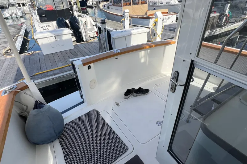 Slide: The Image of 2005 Sabre Flybridge boat interior with shoes and mat, docked in marina. - 18