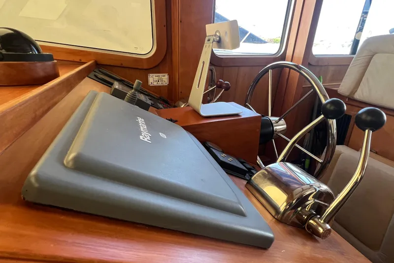 Slide: The Image of 2005 Sabre Flybridge helm with Raymarine navigation and dual throttle controls. - 21