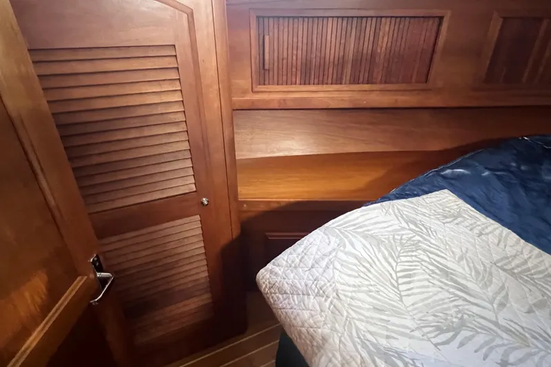 Slide: The Image of Wooden interior of 2005 Sabre Flybridge yacht cabin with bed and closet. - 30