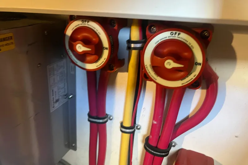 Slide: The Image of Electrical switches and wiring in a 2005 Sabre Flybridge boat. - 46