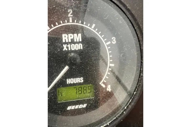 Slide: The Image of Tachometer of 2005 Sabre Flybridge showing 7889 hours and RPM gauge. - 63