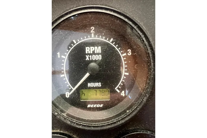 Slide: The Image of RPM gauge of 2005 Sabre Flybridge showing 778 hours. - 64