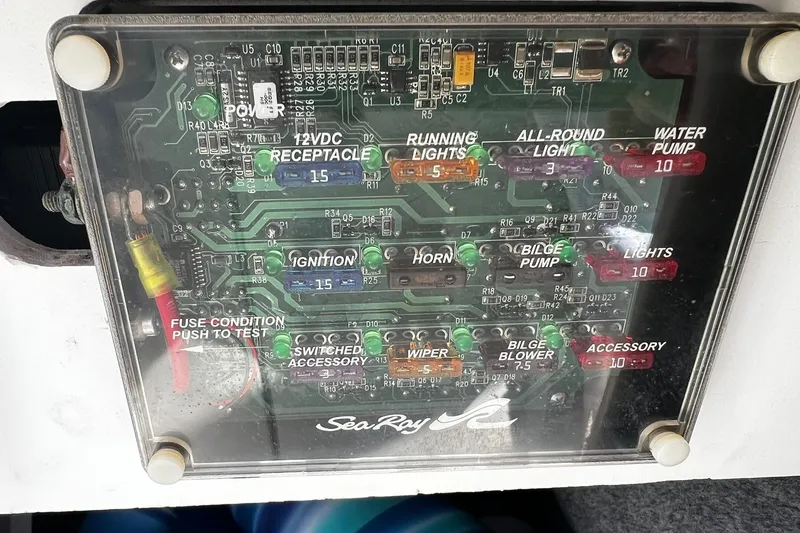 Slide: The Image of Fuse panel of a 2003 Sea Ray 220 Sundeck boat, labeled circuits and fuses. - 15