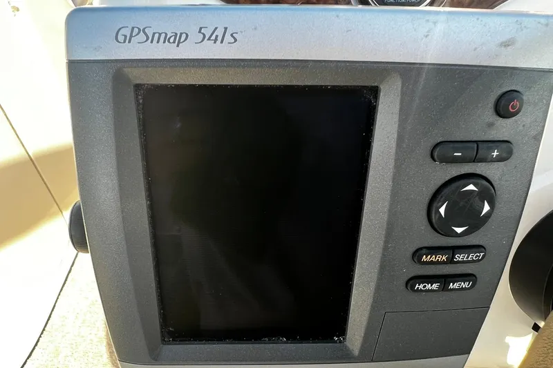 Slide: The Image of GPSmap 541s device on 2003 Sea Ray 220 Sundeck boat dashboard. - 16